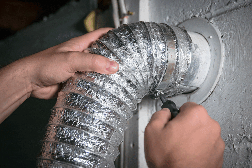 Shows what the dryer vent hose looks like and how to disconnect from the external exhaust